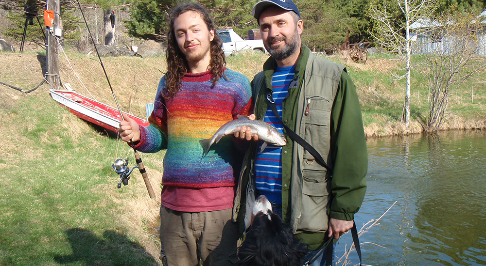 nico, maestro and lawrence holding a trout